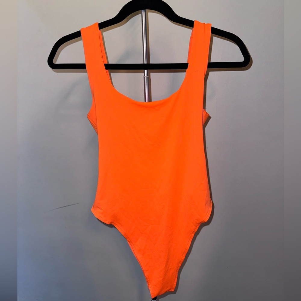 Bright orange body suit (thong)